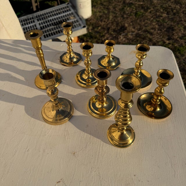 Collection of brass candlesticks. Varying brands, most notable is Baldwin. Made in india, USA, and Korea.