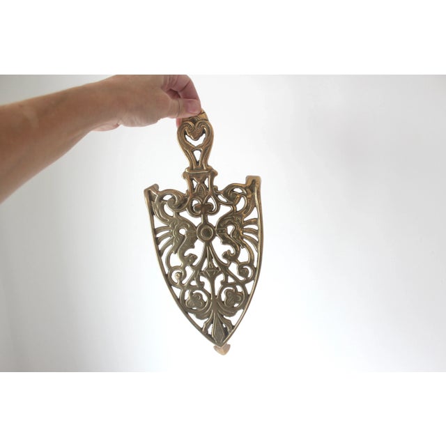 This beautiful trivet is perfect for under an iron, a planter, or a hot dish. It is marked Made in Italy. Has nice patina....