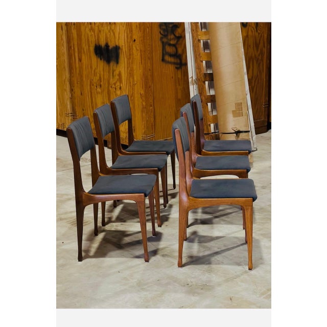 Set of 6 chairs Mod. 693, Designed by Carlo de Carli for Cassina. Solid walnut, chairs have been recently recovered in a...
