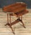 An elegant early 19th-century English Regency rosewood writing desk featuring a beautifully figured rectangular top with...