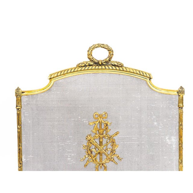 This is a superb and very decorative French Empire revival ormolu and mesh fire-screen, circa 1870 in date. The shaped...
