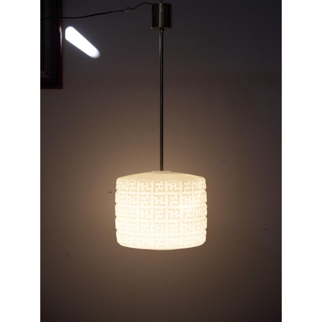 Opaline triplex glass in a structured geometric pattern. Made in former Czechoslovakia. No damage to a glass shade. Brass...