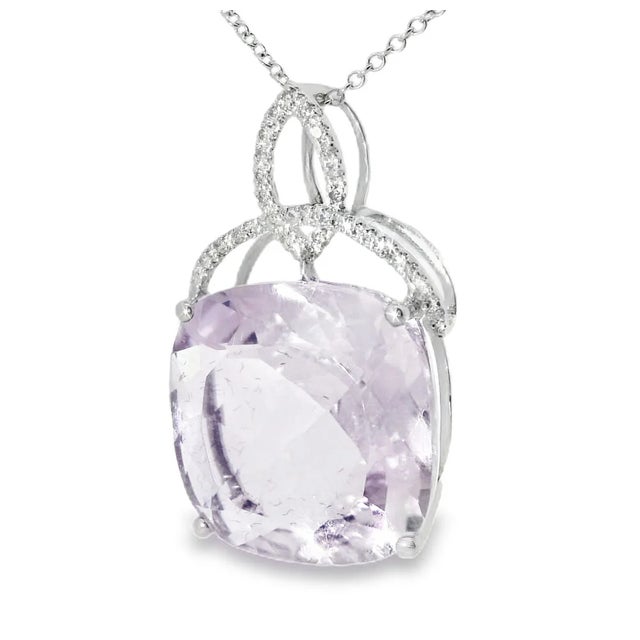 This pendant is crafted in 18K white gold and features 29 round single-cut diamonds 0.1 carats along with one large...