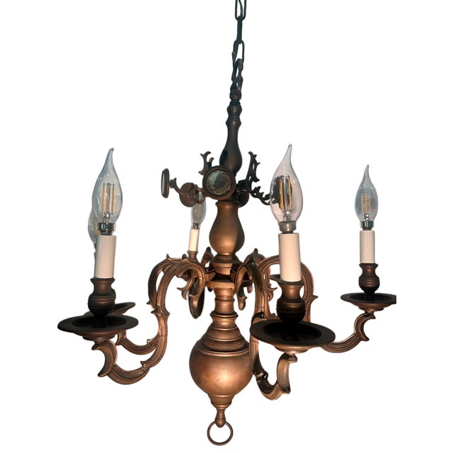 Solid cast bronze chandelier in the Dutch Baroque tradition, originally made as a candle fixture and later electrified....