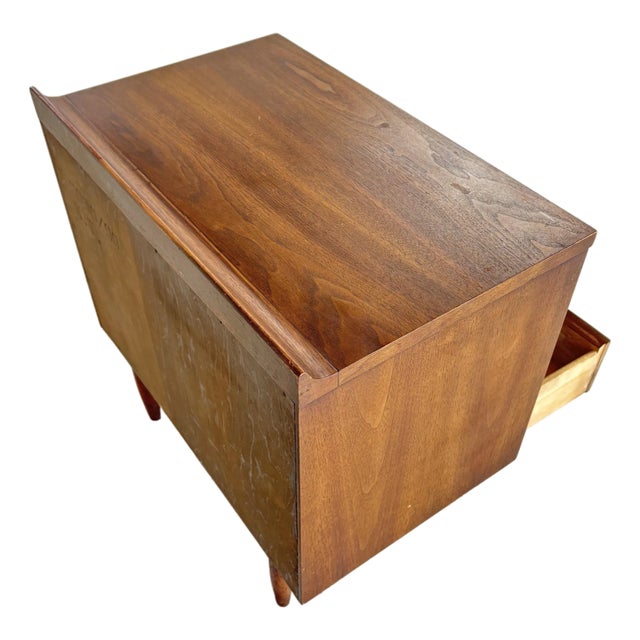 Classic Broyhill Sculptra nightstand showcasing iconic mid-century modern design. Crafted in beautifully grained wood,...