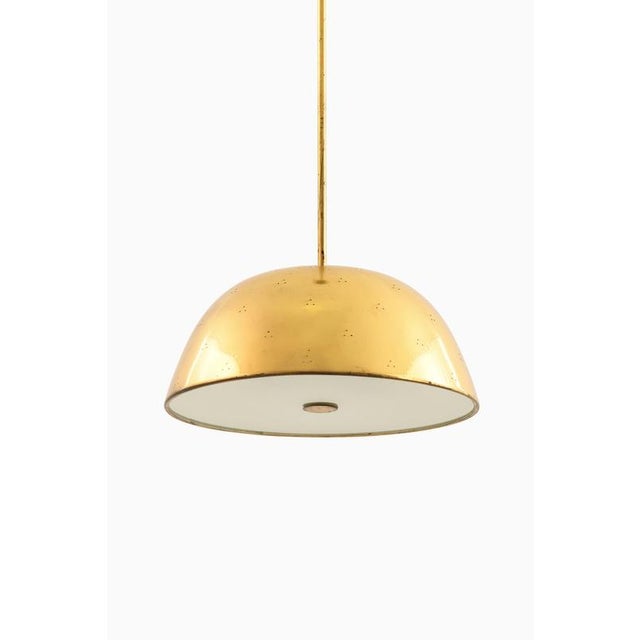 The ceiling lamp model number 1953, designed by paavo tynell and produced by taito oy in finland during the 1950s,...