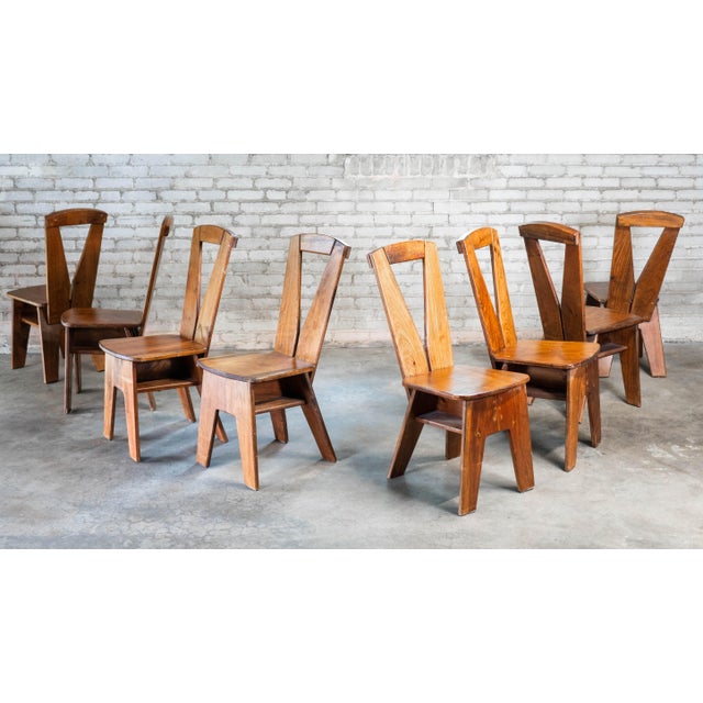 Set of 8 architectural vernacular dining chairs from the 1970s European studio craft movement, styled in the manner of...