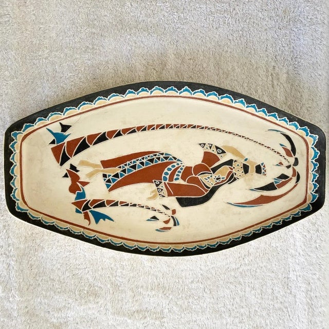 Amazing vintage middle eastern hand painted platter, made Is Israel. Features a lady carrying a jug on her head beneath a...