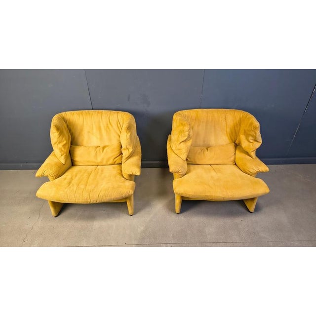 Pair of exquisite yellow suede portovenere wingback chairs designed by Vico Magsitretti for Cassina. Very comfortable...