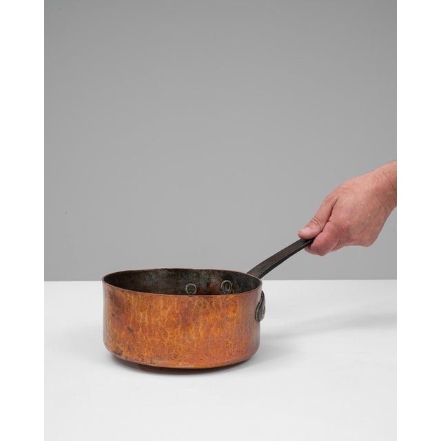 This 19th Century French copper pot exemplifies the durability and craftsmanship of traditional French cookware. Hand-...