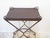 This iron small console table has a patinated finish.