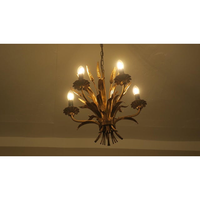 Hans Kögl 1960-70 chandelier with patinated gold plated metal leaves and wheatsheaves. I have official proof of...