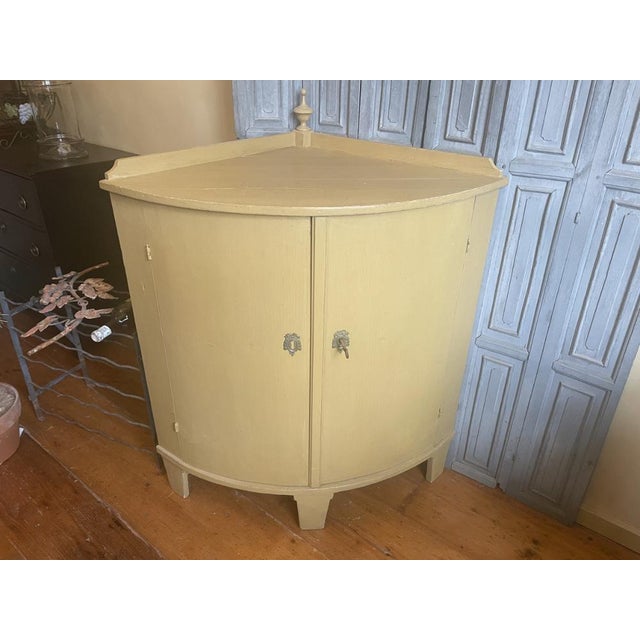 A particularly beautiful and sleek 19th century corner cupboard, period 1870. originating from our own country. The...