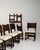 Conceived in France during the height of the Brutalist movement, this commanding set of six oak dining chairs embodies the...