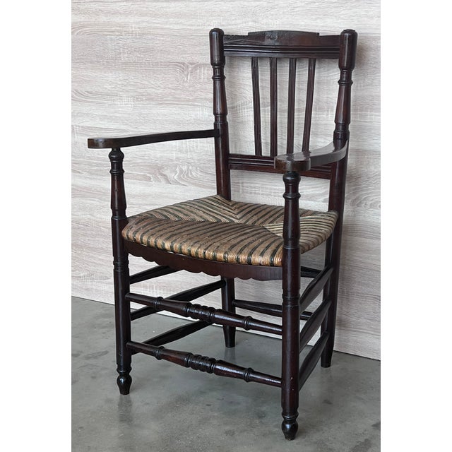 Pair of Spanish horseshoe armchairs with original bicolor cane seat Completely restored. Height to the arms : 26.37in....