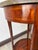 Late 18th/early 19th century round accent table with marquetry and marble top. Gilt bronze sabots and encircling the top...