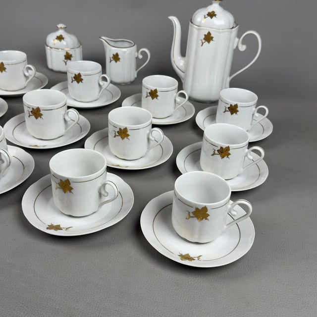 Elegant and luminous tea service for 12 in fine white porcelain with gold decorations, Regent Alba Iulia manufacture...