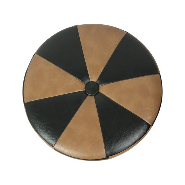 Cool round vintage pouf in patchwork style, made from a wooden base and upholstered in high-quality two-tone brown faux...