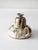 A vintage handmade studio pottery oil lamp, crafted in 1983, showcases a charming chamberstick design with a graceful...