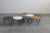 Set of eight hexagonal coffee tables with legs in painted metal and wooden/laminate top, designed by Gio Ponti and...