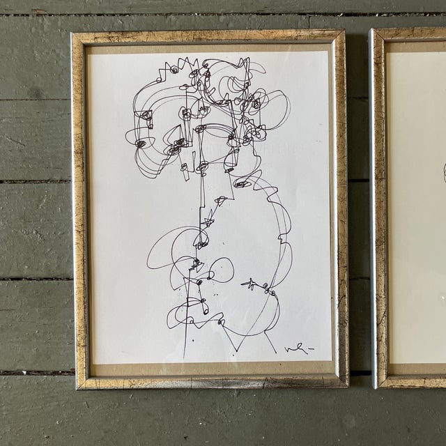 Contemporary original set of two pen and ink drawings by Wayne Cunningham. Framed and signed. Measure 8.5x11 or about...
