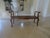 A well carved in walnut versatile bench with a newer cushion. Beautiful caining looks great with out a cushion