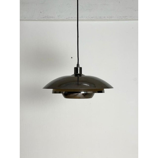 Vintage Danish Chrome Pendant Lamp, 1970s–80s A striking Danish vintage pendant lamp featuring a polished chrome finish...