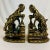These are a pair of bookends crafted from metal that feature two Big Horn Sheep climbing on rocks. The finish has both a...