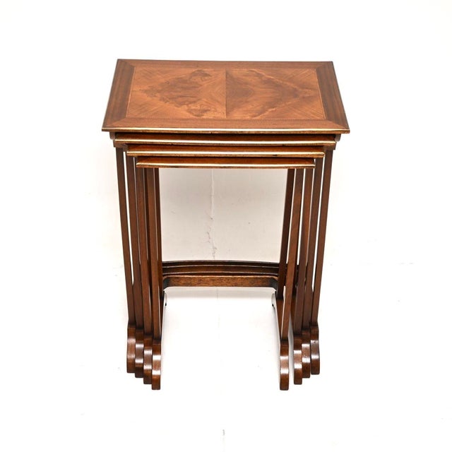 An outstanding antique Edwardian walnut nest of four tables. They were made in England, they date from around the...