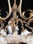 Amazing chandelier from the Art Nouveau period in top quality. Body made of patinated bronze. Glass floral shades. The...