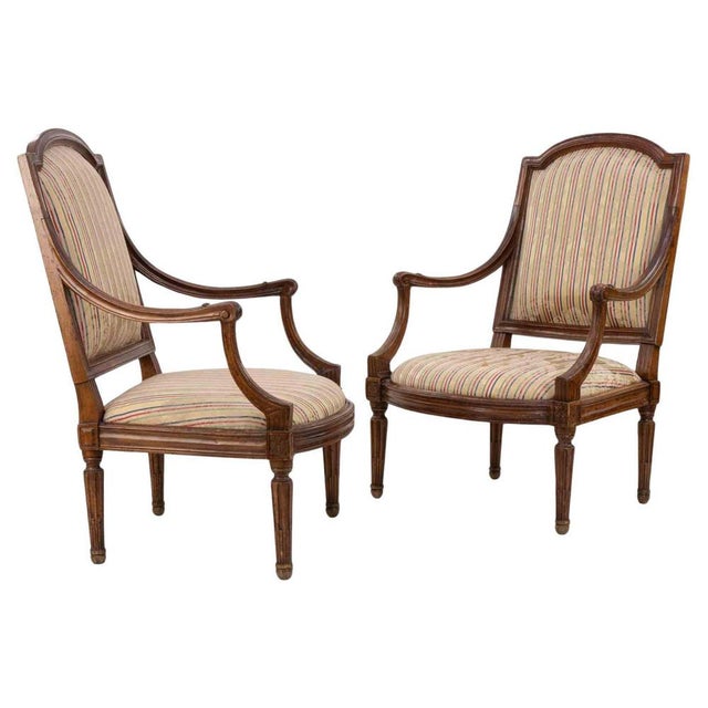 Beautiful pair of walnut Louis XVI chairs realized in Italy in the late 18th Century. Reupholstered in the mid-20th...