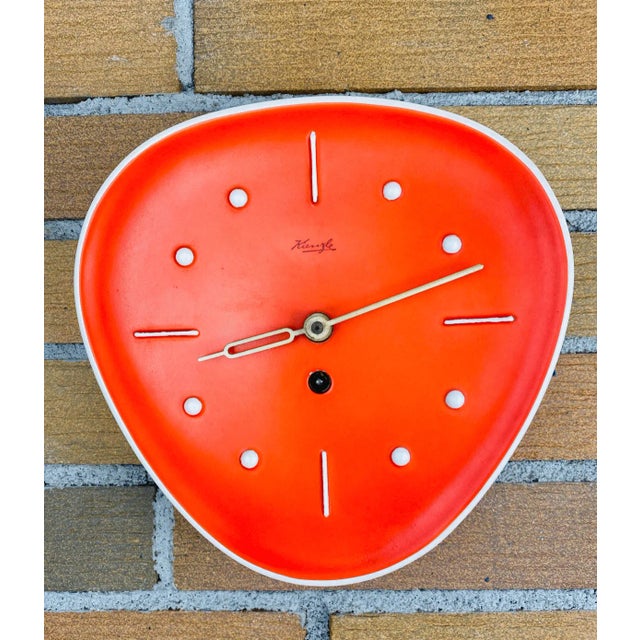 This striking Kienzle wall clock from the 1950s is a true statement piece in iconic mid-century design. The case is made...