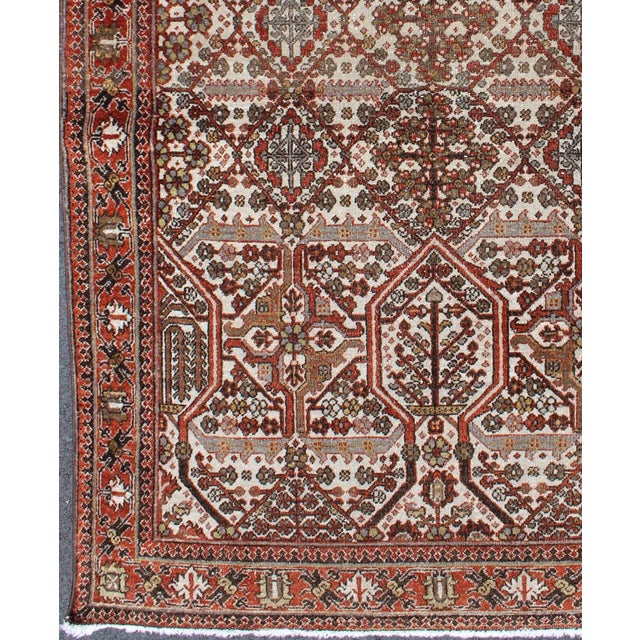 Measures: 3'7 x 5'2. Antique Persian Joshegan Rug in Ivory Background with Red, Green and Blue. Keivan Woven Arts/...