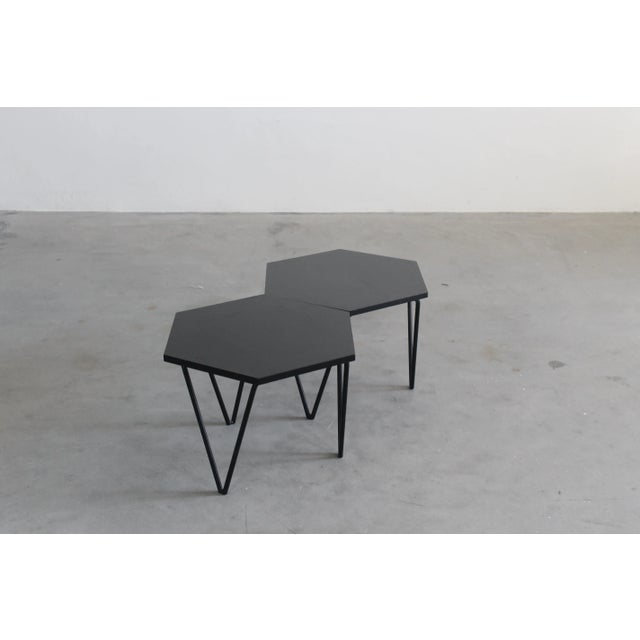 Set of two hexagonal coffee tables with legs in painted metal and wooden/laminate top, designed by Gio Ponti and produced...