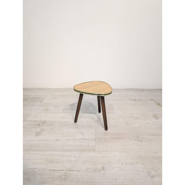 An original table from the Polish People's Republic era in the iconic "patyczak" style, characteristic of the design of...