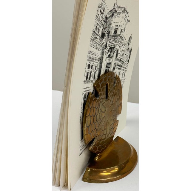 This brass bookend is shaped like a sand dollar and is perfect for ocean lovers!