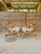 A wonderful pair of vintage mid-20th century rattan barrel lounge chairs featuring sculptural rounded frames, open...