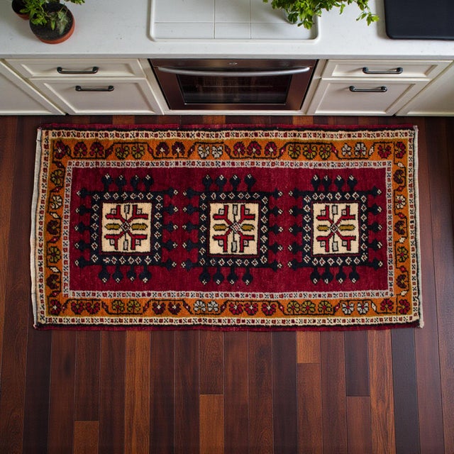 Vintage Turkish hand-knotted small rug from Konya (Central Anatolia), 1970, featuring warm deep burgundy tones and...