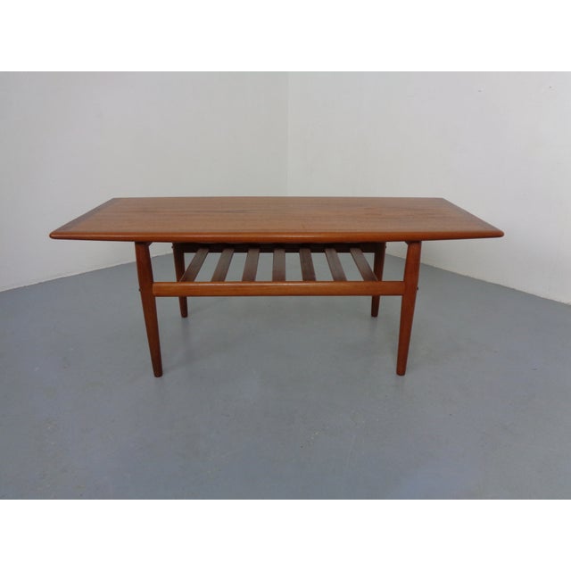 Rare, small version (130 cm) of the teak coffee table by Grete Jalk for Glostrup from the 1960s. This piece has an...
