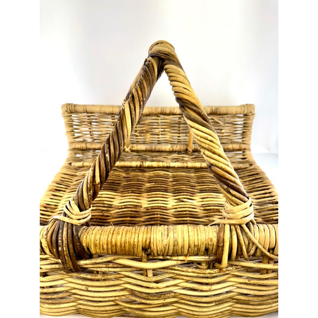 A beautifully crafted vintage wicker gathering basket featuring a generous scale and a striking hand-twisted double...