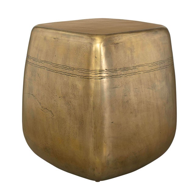 This Captivating Side Table, Casted Entirely From Aluminum, Showcases A Textured Aged Brass Finish With Subtle Banding...