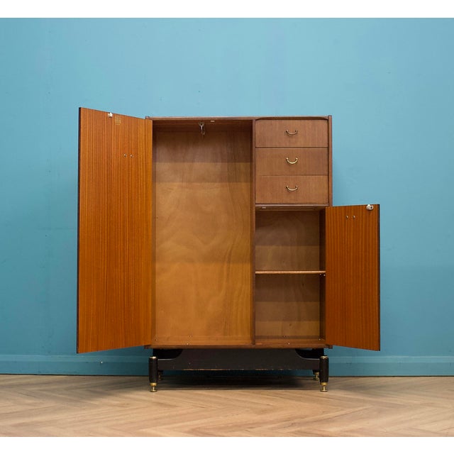 A mid-century compact wardrobe (compactum) by G-Plan, dating to the late 1950s–early 1960s and attributed to the Tola...