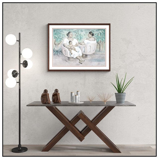The artwork here, "Yucetecas En El Parque", is a wonderful depiction of a mother holding her child while relaxing with her...