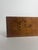This carpenter’s display piece, crafted from a block of wood with a veneer features two inlaid designs demonstrating...