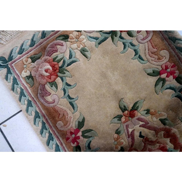 Handmade vintage Art Deco Chinese rug in beige, green and red colors. The rug is from the end of 20th century in original...