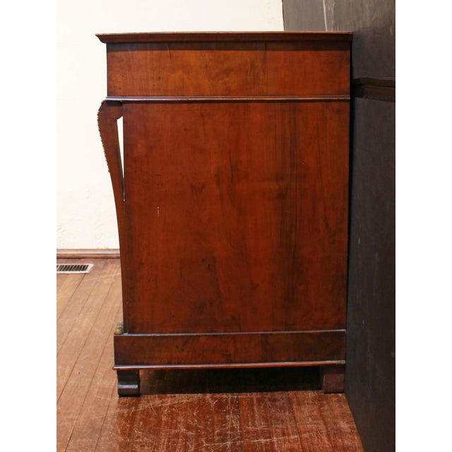 Circa 1815 French Empire 4-drawer commode. Restrained, elegant design typical of the period. Subtly shaped, flattened...