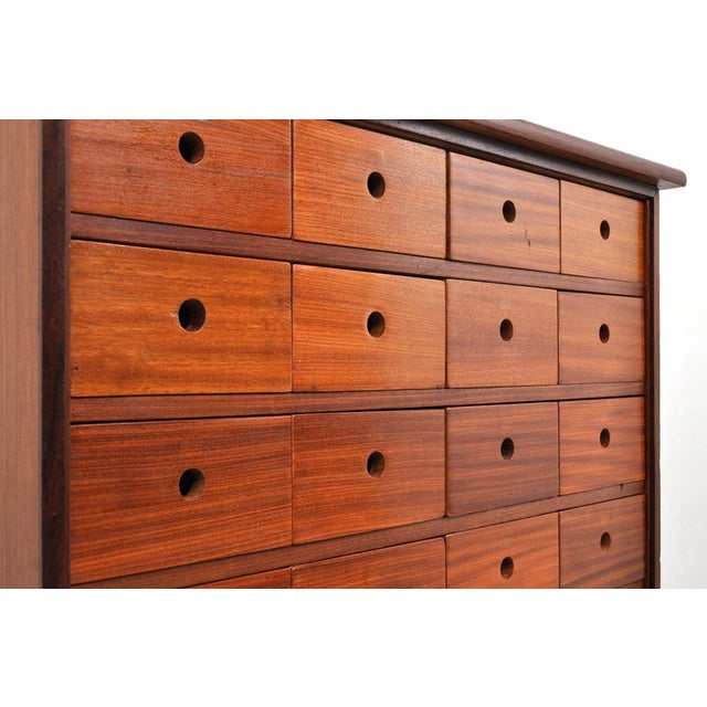 Mahogany chest of drawers with 26 drawers. The drawers have a beautiful color gradation. Solid mahogany top. Late 1930s....