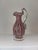An exquisite pair of mid-20th-century Venetian art glass, showcasing the pinnacle of Murano hand-blown craftsmanship. This...