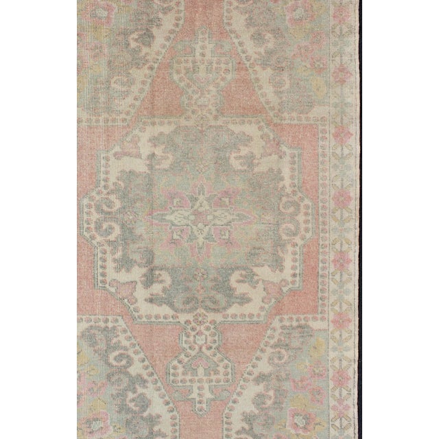 Pink, light green, and ivory vintage rug with flower medallion pattern, Keivan Woven Arts / rug EN-176597, country of...