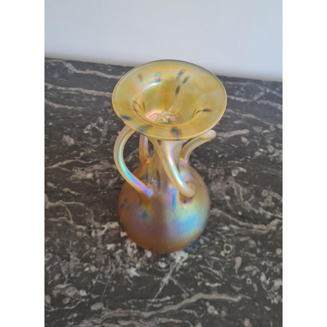 An extraordinary and highly sculptural example of Bohemian Art Nouveau glass, this rare vase showcases the refined...
